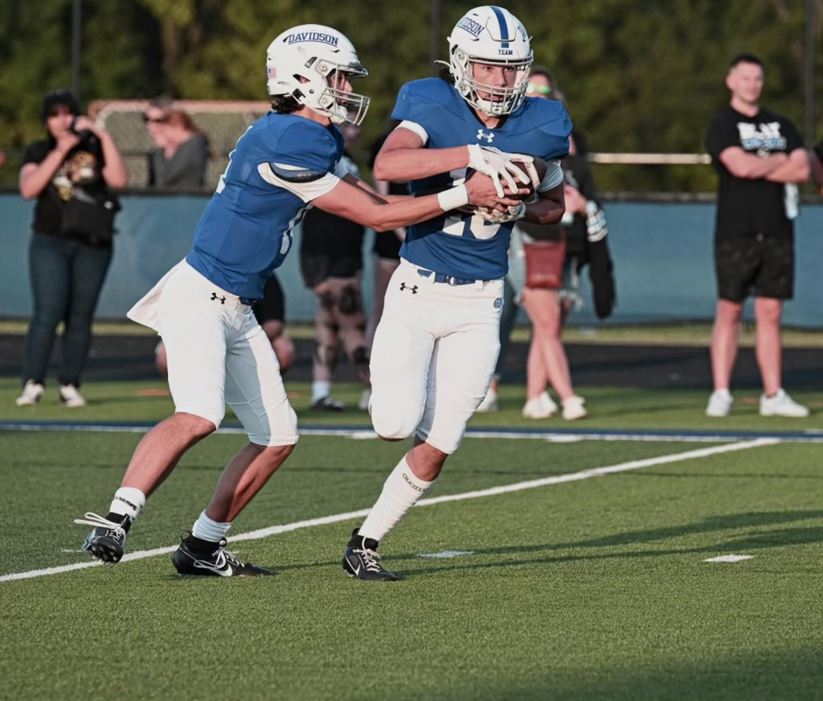 Johnny DiBlasio hands the ball to Josh DiBlasio (photo courtesy of the DiBlasio family)